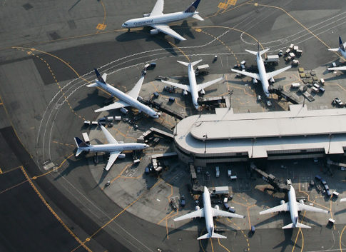 airplanes at an airport terminal