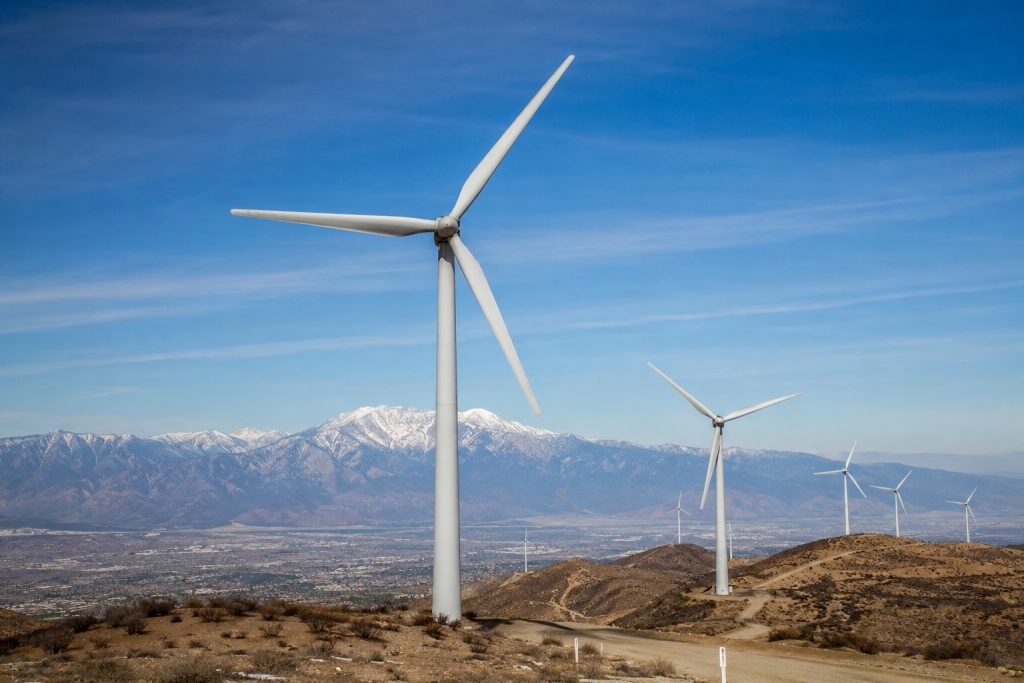 Wind turbine in desert hills.